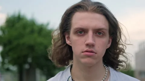 Close-up of a young stylish man looking into the camera Stock Footage 204804428