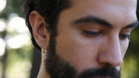 Close up on young thoughtful man looking up as if praying Stock Footage 136514009