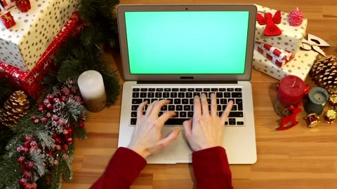 Close up of young woman hands using modern laptop keyboard with blank green Vidéo 146368445