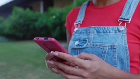 Close up young woman hands using mobile phone at city street. Stock Footage 279986558