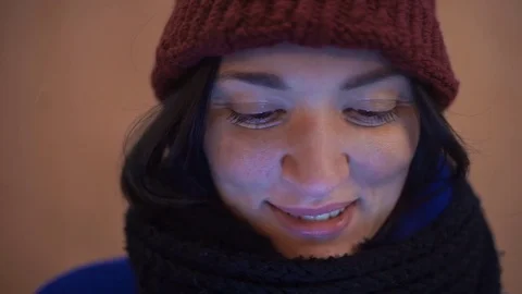 Close up of young woman smiling using smartphone standing outdoors Stock Footage 83069943