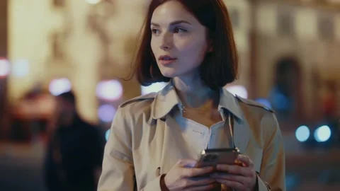 Close up young woman stand using mobile phone to type a text message in the Stock Footage 156459640
