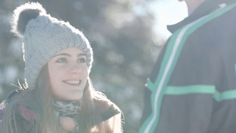 Close up of young woman stealing her boyfreind's cap and running away Vídeo Stock 85077458