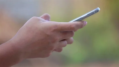 Close-up of a young woman using a smart phone Video stock 73614353