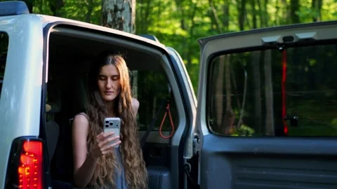 Close-up of a young woman using a smartphone while relaxing... Vídeos de archivo 340290931