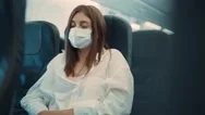 Close Up Young Woman Wearing Protective Medical Mask Sleeping In The Aircraft Stock Footage
