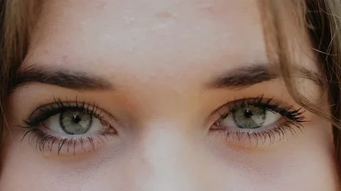 Close-Up of Young Woman’s Blinking Eyes Stock Footage 131103034