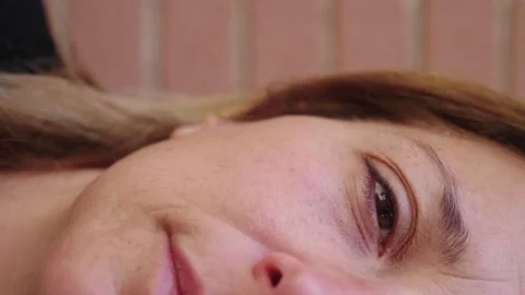 Close-up of young woman's half face expressing deep emotion Video stock 278367632