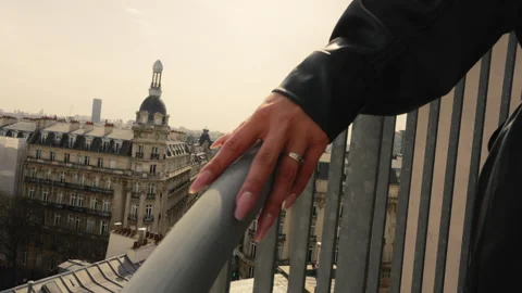 Close up of a young woman's hand going up outdoor stairs, with the Paris Stock Footage 243558711