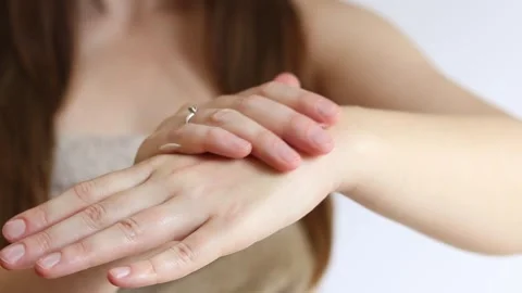 Close-up of young woman's hand with moisturizing cream Stock Footage 310240513