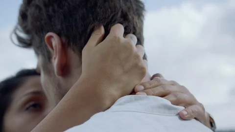 Close up of a young woman's hands caressing her boyfriend's hair. Stockbeeldmateriaal 116078142