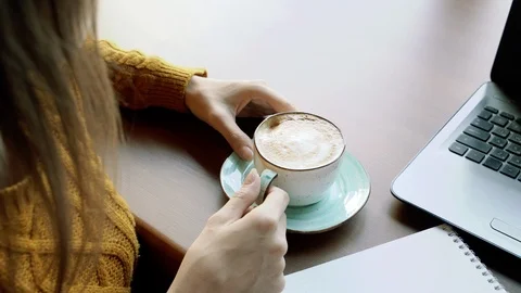Close up of a young woman's hands holding a cup of coffee Stock Footage 117169068