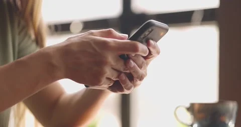 Close up of young woman's hands holding black telephone,surfing the internet and 스톡 동영상 159372863