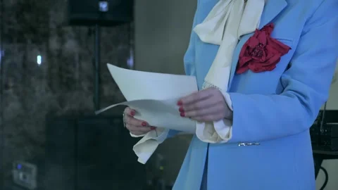 Close-up of a young woman's hands looking at documents, script Stock Footage 333481114
