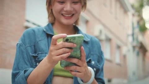 Close-up of young woman's hands with mobile phone Stock Footage 250843705