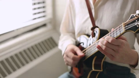 Close Up Young Woman's Hands Playing Mandolin, Practicing Bluegrass Instrumen Stock Footage 237646162