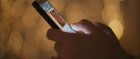 Close up of a young woman's hands typing a message, scrolling pictures Stock Footage 123441498