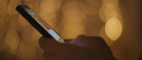 Close up of a young woman's hands typing a message, texting on her phone Stock Footage 123442031