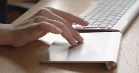 Close-Up Of Young Women Hands Using Bluetooth Trackpad On Wooden Desk 4K Stock Footage 47527787