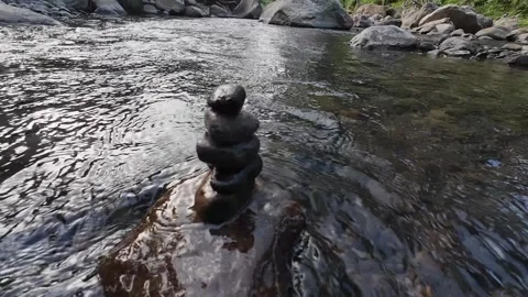 Close Up of Zen Stone Stack in Flowing River Water 4K Stock Footage 337060806