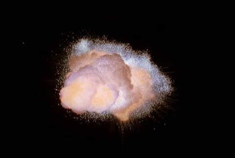 Close-up zero gravity explosion with sparkling silver-blue debris Stock Footage 86915407