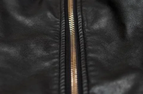 Close up of zip on black leather material Foto stock