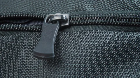Close up zipper lock of green backpack Stock Footage 152143462