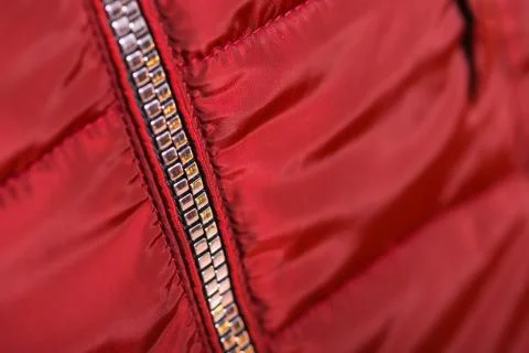 Close up of zipper on red jacket , winter fashion outfit. Jacket isolated on  Stock Photos
