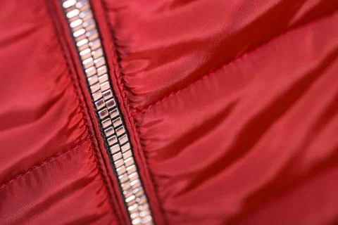 Close up of zipper on red jacket , winter fashion outfit. Jacket isolated on  Stock Photos