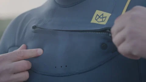 Close up zipping up wetsuit Stock Footage 262757679