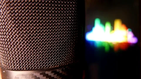 Close-up (zoom in): microphone in an audio recording studio. Sound levels moving Stock Footage 345938871