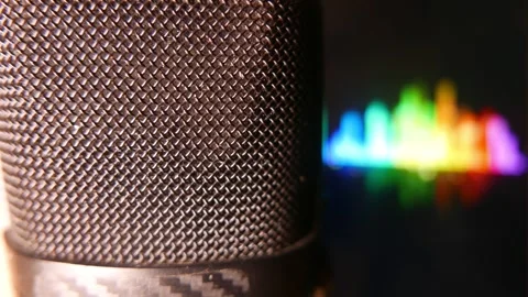 Close-up (zoom in): a microphone in a recording studio. Sound levels moving Stock Footage 347750097