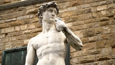 Close up to zoom out shot of David (Michelangelo) statue in Florence Stock Footage 89781336