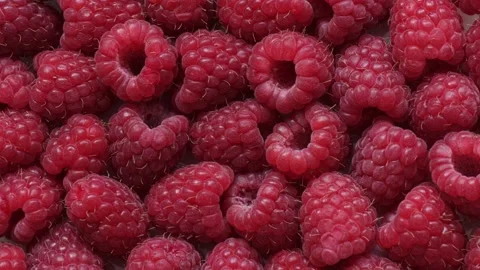 Close-up zoom in a smooth motion of fresh red raspberry. Stock Footage 136895688