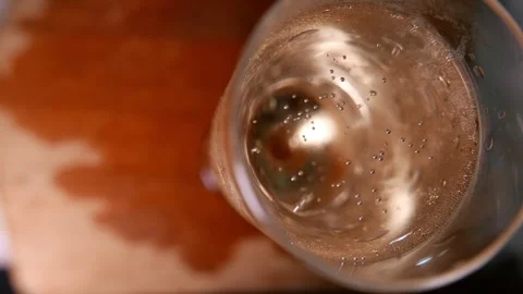 Close-up (zoom in) of sparkling wine bubbles rising in a glass. Champagne glass 스톡 동영상 343695836