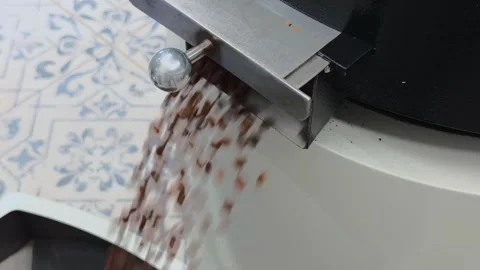 Close up Zooming Out to Medium Shot of Fresh Roasted Coffee Beans Dischargi.. 스톡 동영상 332155585