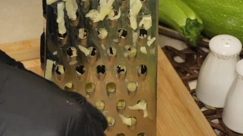 Close-Up of Zucchini Being Grated Stock Footage 311318409