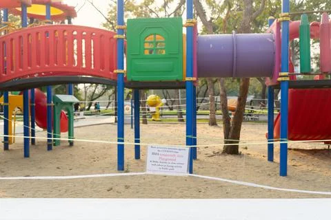 Closed and empty playgrounds in Lumpini public park, Bankok Thailand because  Stock Photos