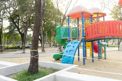 Closed and empty playgrounds in Lumpini public park, Bankok Thailand because  Stock Photos