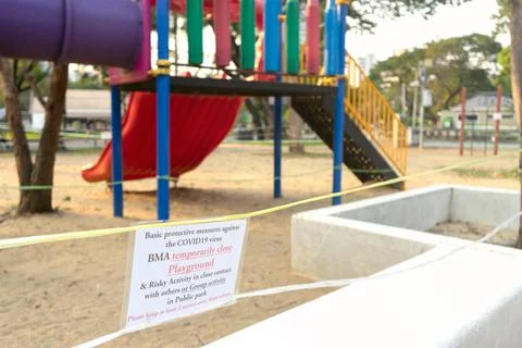 Closed and empty playgrounds in Lumpini public park, Bankok Thailand because  Stock Photos