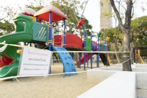 Closed and empty playgrounds in Lumpini public park, Bankok Thailand because  Stock Photos