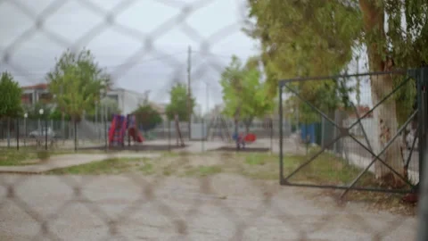 Closed and sealed playground, view through a wired fence, pull focus with Video stock 145360229