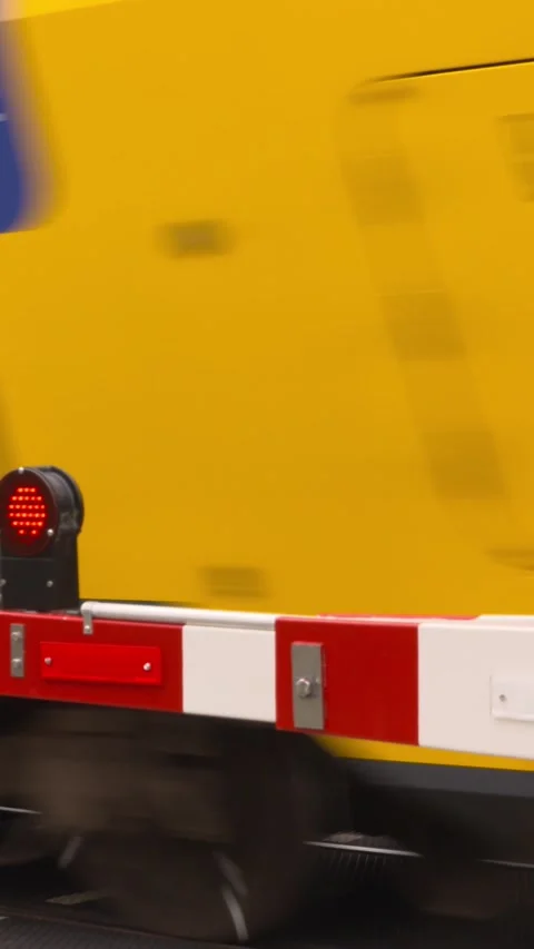 Closed automatic boom barriers in a level crossing - alarm lights Stock Footage 311575375