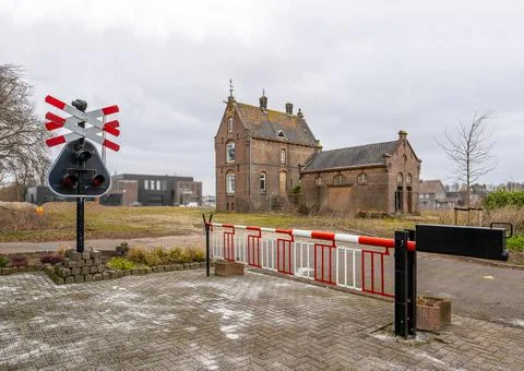 Closed barriers at a level crossing Stock Photos