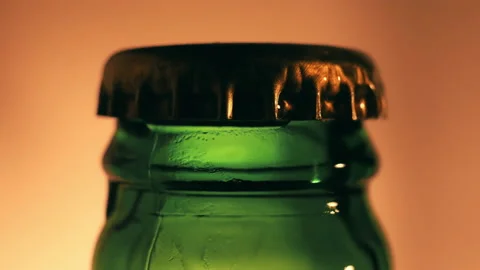 Closed beer bottle close-up on a light background. Video stock 144321873