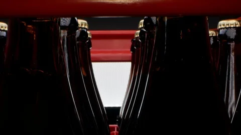 Closed beer bottles in a row in a box close-up Stock Footage 125403395