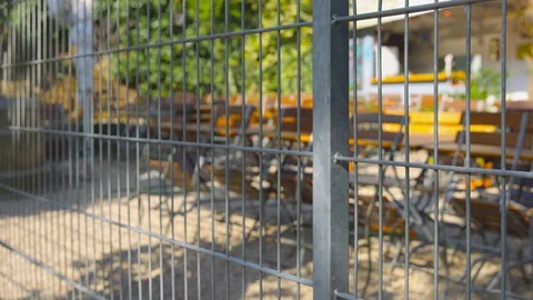 Closed beer garden - camera pan - shot from public ground Stock-Footage 128597255