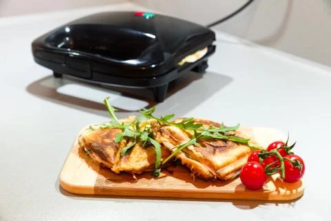 Closed black sandwich maker Stock Photos