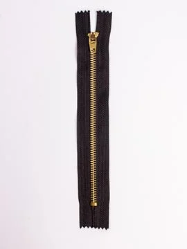 Closed black zipper with metal pull Stock Photos