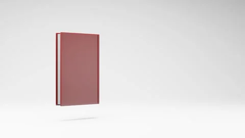 Closed Book Spinning on Studio Light Gray Background Video stock 236225900